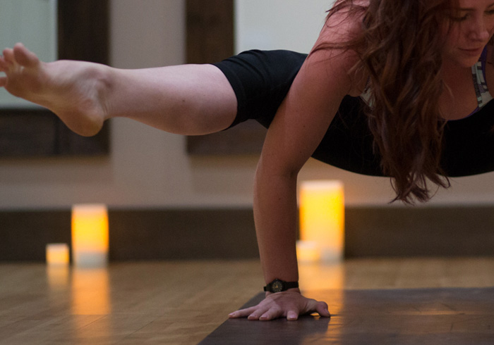 Heroic Fitness Studio / portfolio index image / close-up of a woman holding a yoga pose